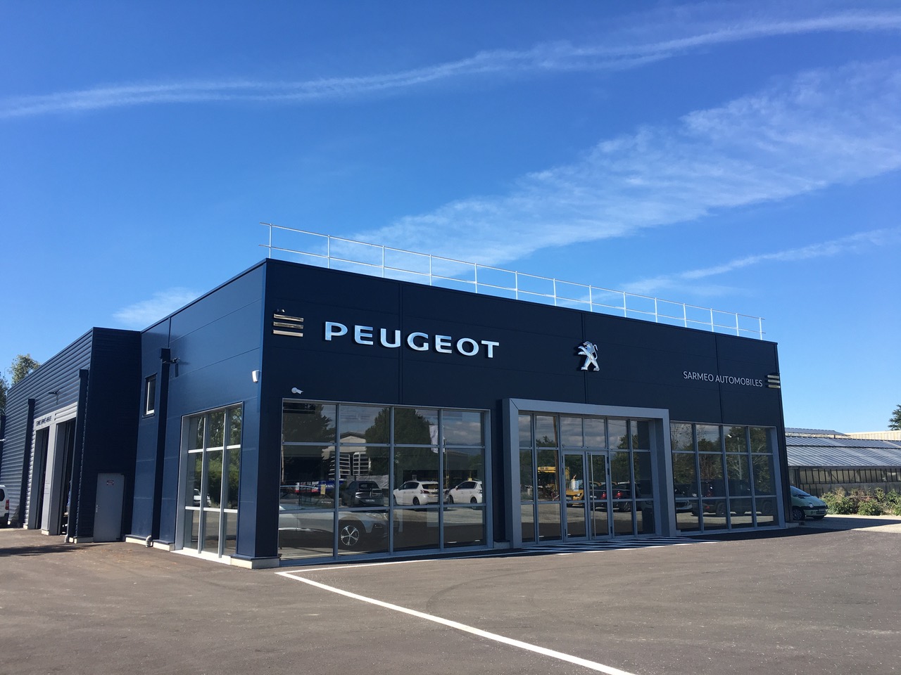 Construction d’un garage automobile selon les normes Peugeot